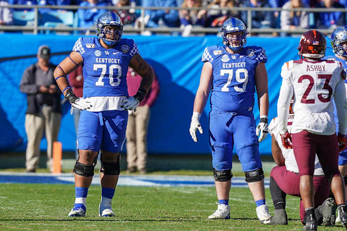 A versatile lineman, Darian Kinnard (left) has the size and strength to be a difference-maker in the NFL.